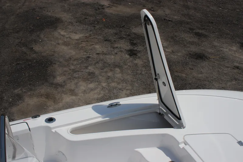 Slide: The Image of Open storage compartment on 2026 Tidewater 1910 Bay Max boat deck. - 9
