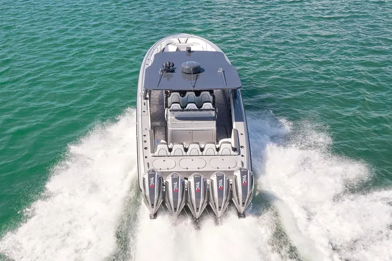 Slide: The Image of 2022 Midnight Express 43 Open boat cruising on open water, rear view. - 11