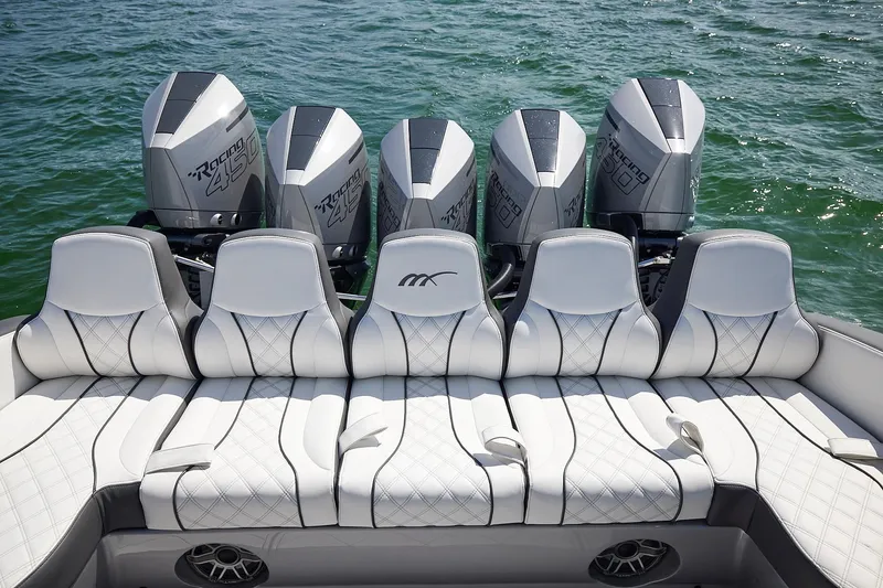 Slide: The Image of Luxury seating and powerful engines on a 2022 Midnight Express 43 Open boat. - 18