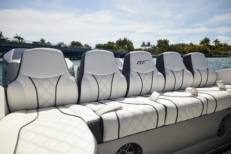Slide: The Image of Luxurious seating on 2022 Midnight Express 43 Open boat, featuring elegant white upholstery. - 19
