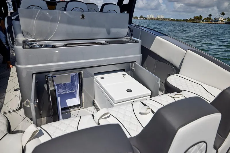 Slide: The Image of 2022 Midnight Express 43 Open boat interior with seating and storage compartments. - 20