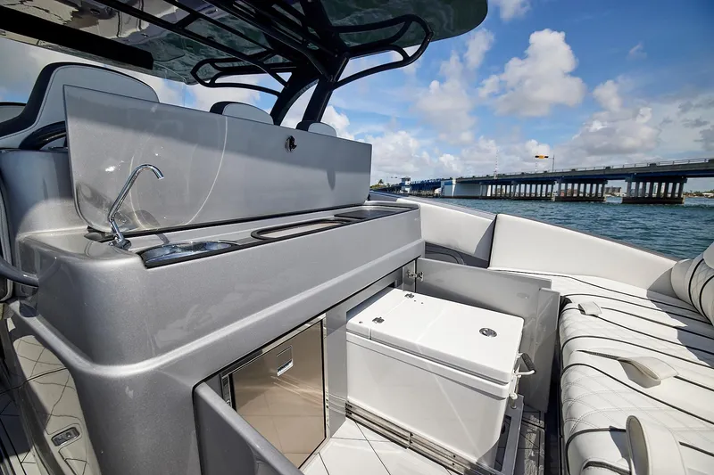 Slide: The Image of Luxurious 2022 Midnight Express 43 Open yacht interior with sleek kitchenette and seating. - 21