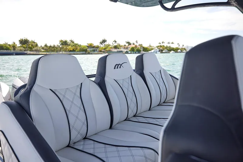 Slide: The Image of Luxurious seating on 2022 Midnight Express 43 Open boat with scenic water view. - 28