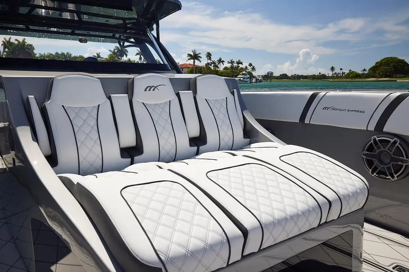 Slide: The Image of Luxurious seating on 2022 Midnight Express 43 Open boat with quilted white upholstery. - 30