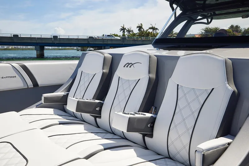 Slide: The Image of Luxurious seating on 2022 Midnight Express 43 Open boat with elegant design and cup holders. - 31