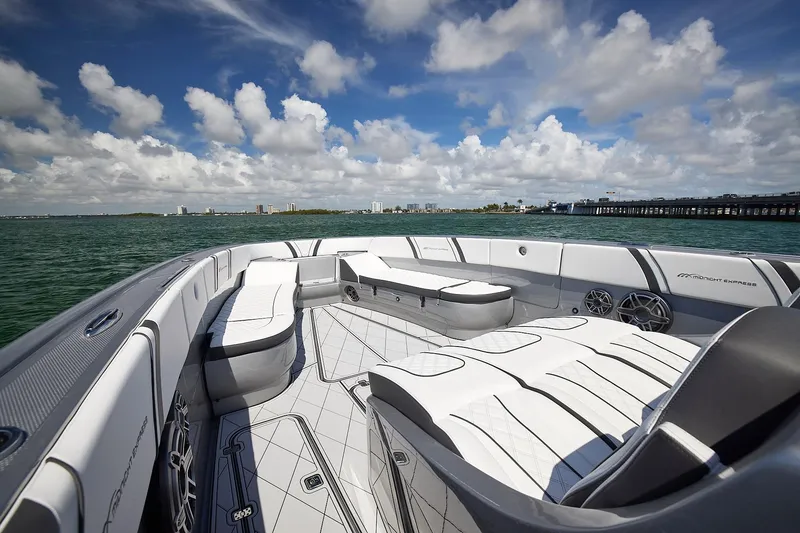 Slide: The Image of Luxurious 2022 Midnight Express 43 Open boat interior with spacious seating and scenic ocean view. - 33