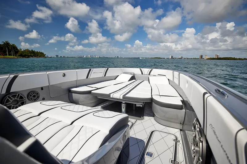 Slide: The Image of Luxurious 2022 Midnight Express 43 Open boat interior with plush seating on open water. - 36