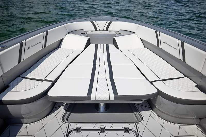 Slide: The Image of Luxurious seating on 2022 Midnight Express 43 Open boat, featuring elegant white and gray upholstery. - 37