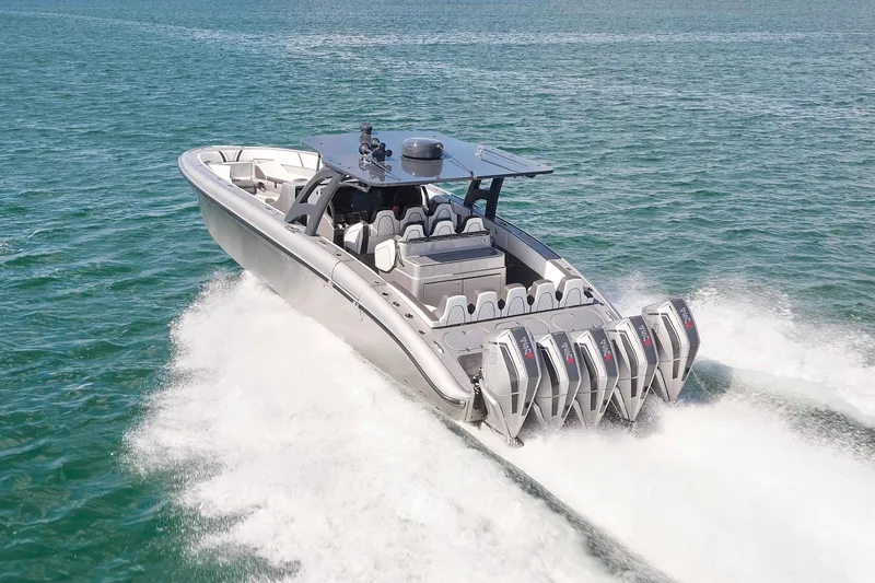Slide: The Image of 2022 Midnight Express 43 Open boat cruising on open water with multiple engines. - 6