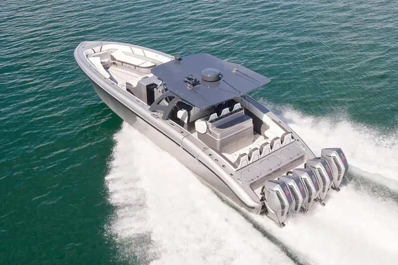 Slide: The Image of 2022 Midnight Express 43 Open boat cruising on water with multiple outboard engines. - 8