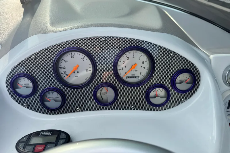 Slide: The Image of Dashboard of a 2004 Baja 275 boat with gauges and controls. - 10
