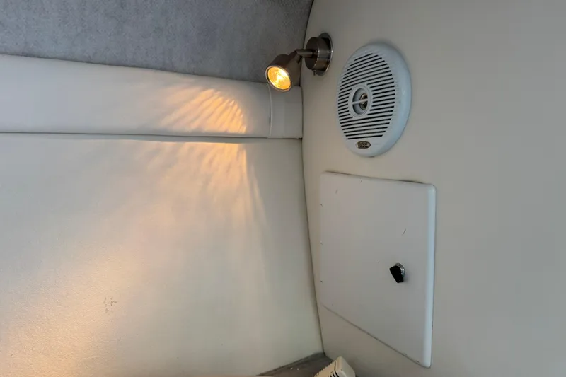 Slide: The Image of Interior of a 2004 Baja 275 boat with light and speaker. - 16