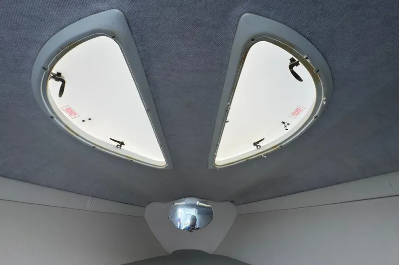 Slide: The Image of Interior view of 2004 Baja 275 boat cabin with dual overhead hatches. - 17