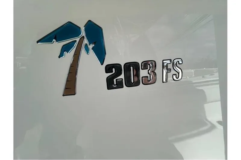 Slide: The Image of 2024 Key West 203 FS logo with palm tree design on boat exterior. - 17