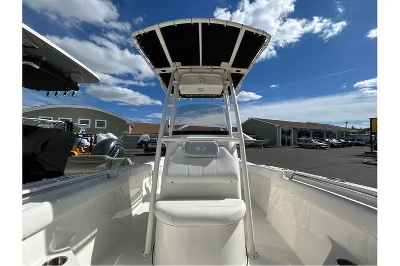 Slide: The Image of 2024 Key West 203 FS boat with T-top under a clear blue sky. - 3
