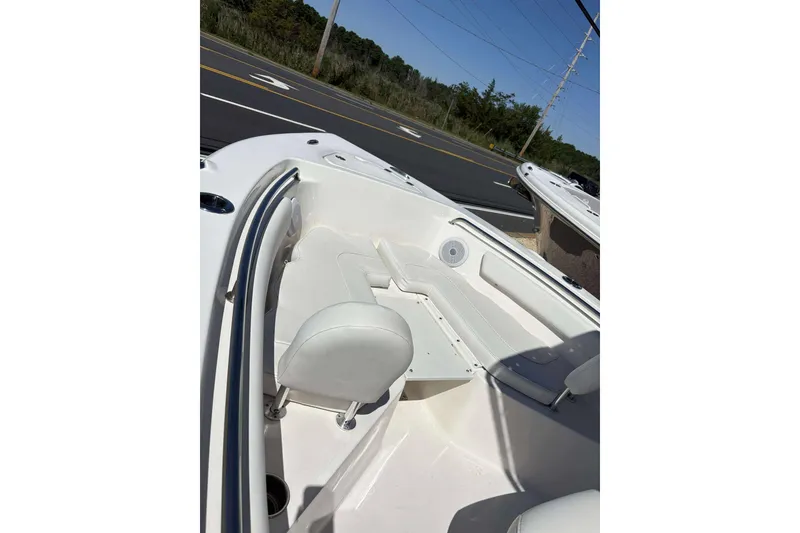 Slide: The Image of 2024 Key West 203 FS boat interior with white seating and sleek design. - 9