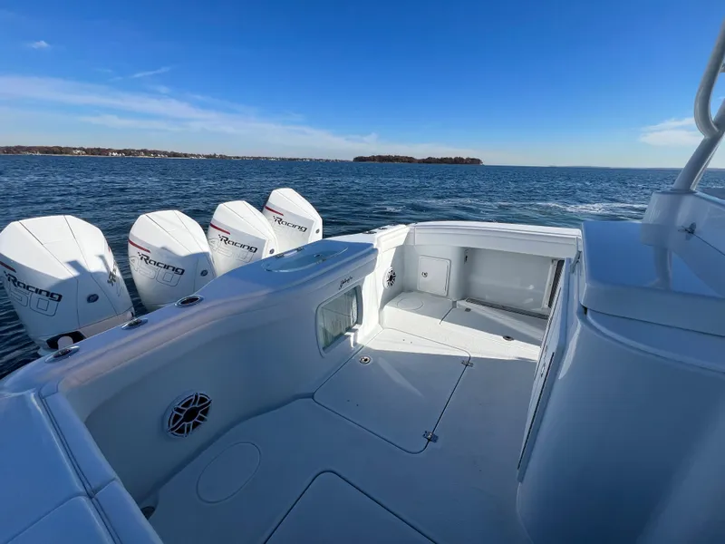 Slide: The Image of 2023 Yellowfin 42 Offshore boat with multiple outboard engines on open water. - 10