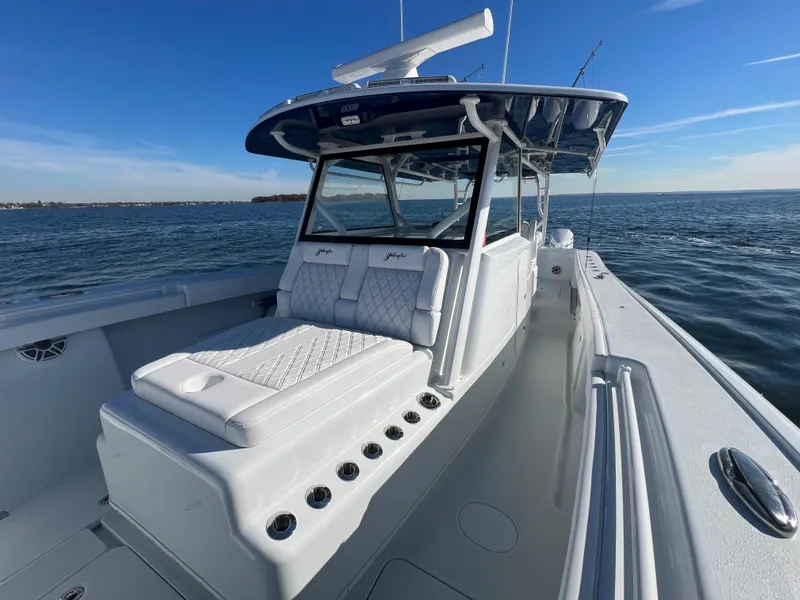 Slide: The Image of 2023 Yellowfin 42 Offshore boat on open water, featuring sleek design and spacious deck. - 19