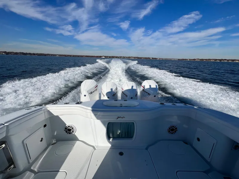 Slide: The Image of 2023 Yellowfin 42 Offshore boat cruising on open water under a clear blue sky. - 20