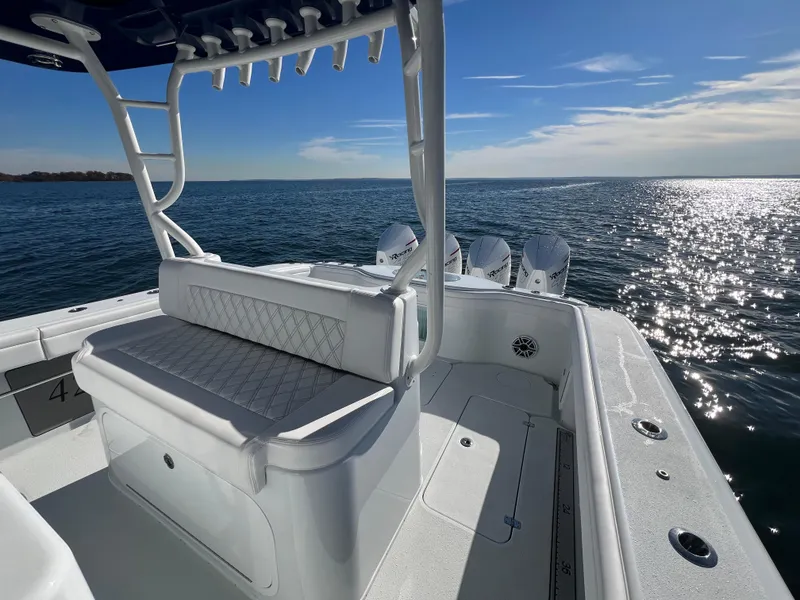 Slide: The Image of 2023 Yellowfin 42 Offshore boat on open water, featuring sleek design and powerful engines. - 8