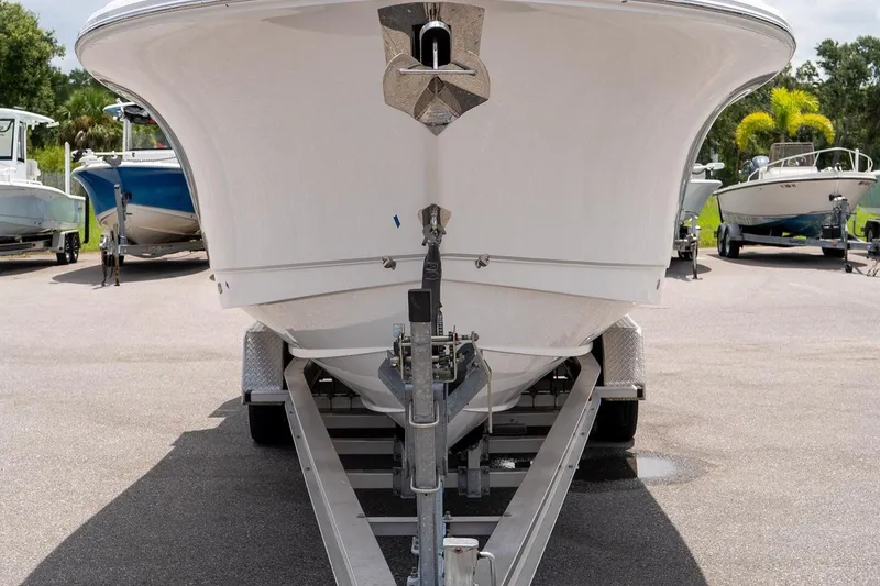 Slide: The Image of 2026 Sea Hunt Gamefish 27 Coffin Box boat on trailer, parked outdoors. - 12