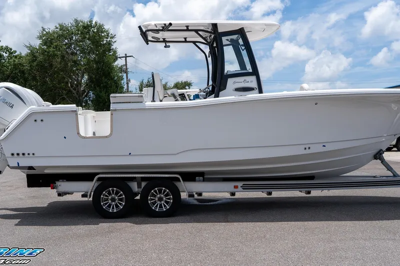 Slide: The Image of 2026 Sea Hunt Gamefish 27 Coffin Box boat on trailer, side view, outdoors. - 18