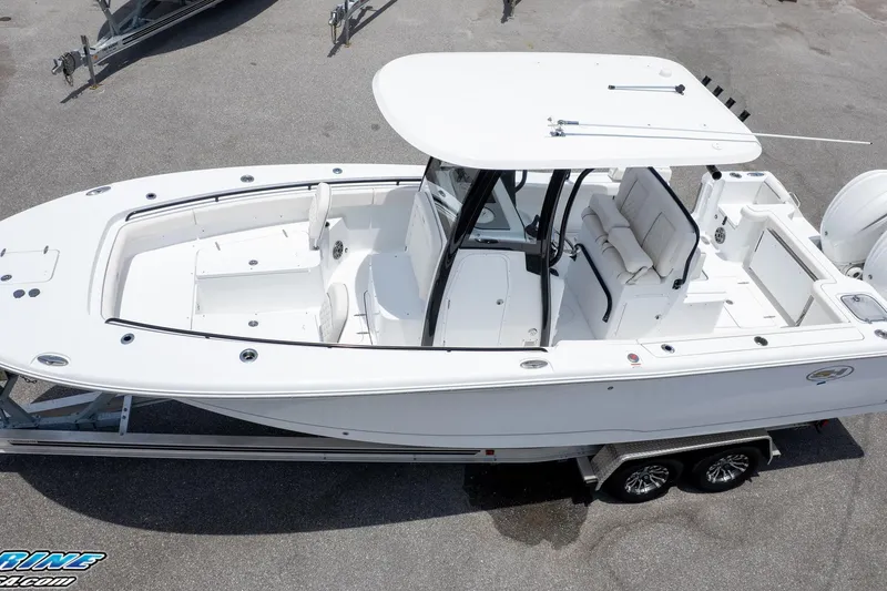 Slide: The Image of 2026 Sea Hunt Gamefish 27 Coffin Box boat on trailer, top view. - 2