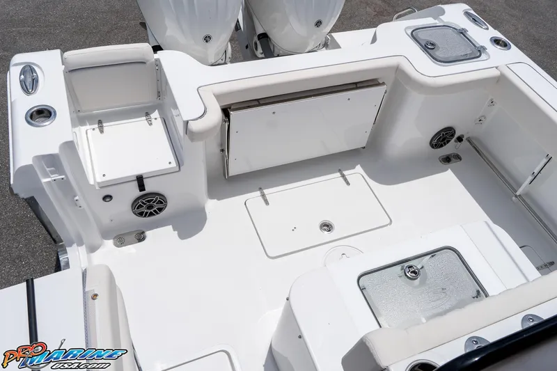 Slide: The Image of 2026 Sea Hunt Gamefish 27 Coffin Box boat interior, featuring storage and seating areas. - 22