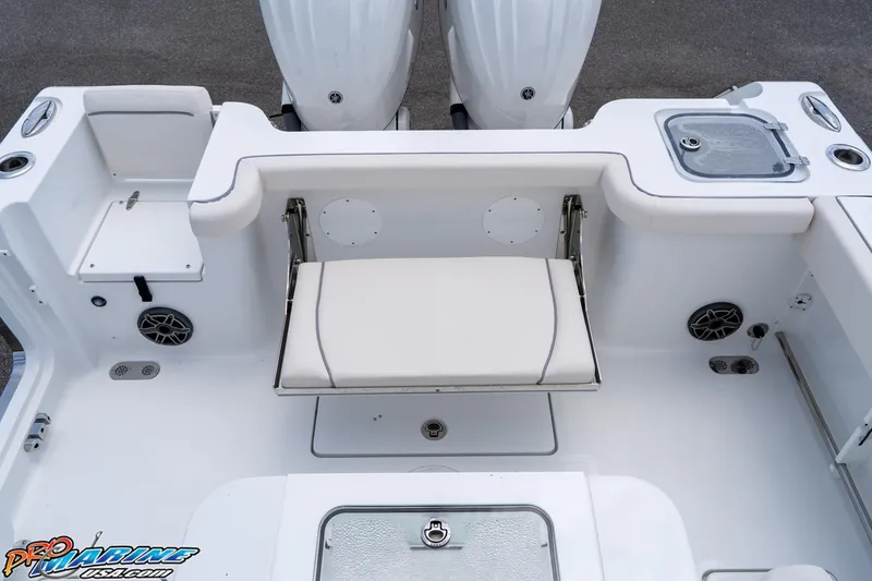 Slide: The Image of 2026 Sea Hunt Gamefish 27 Coffin Box boat interior with seating and storage compartments. - 24