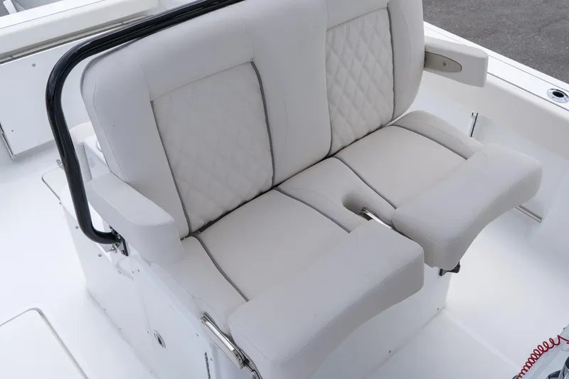 Slide: The Image of 2026 Sea Hunt Gamefish 27 Coffin Box boat seating, featuring cushioned dual seats with armrests. - 27