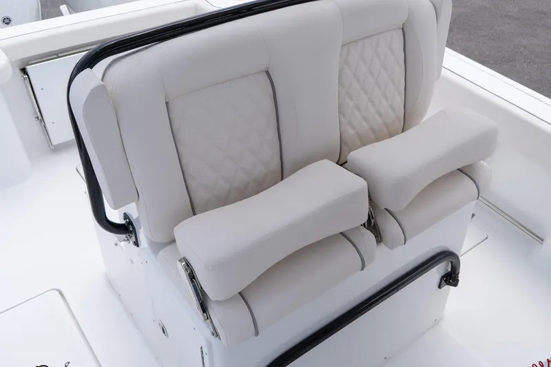 Slide: The Image of 2026 Sea Hunt Gamefish 27 Coffin Box boat seating with cushioned armrests. - 28