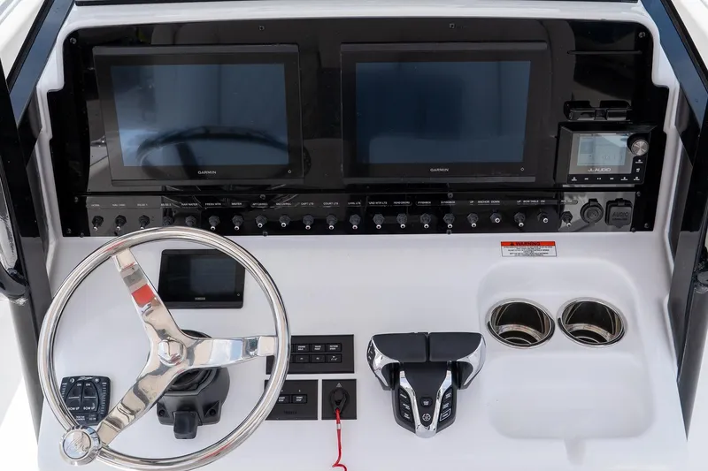 Slide: The Image of 2026 Sea Hunt Gamefish 27 Coffin Box dashboard with dual screens and controls. - 32