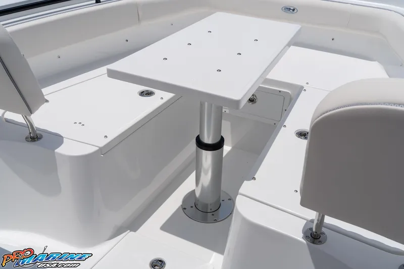 Slide: The Image of 2026 Sea Hunt Gamefish 27 Coffin Box boat interior with seating and table. - 38