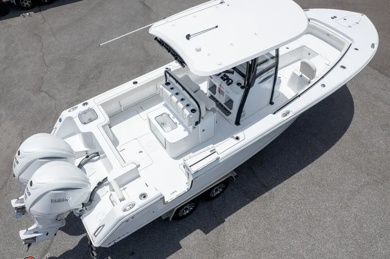 Slide: The Image of 2026 Sea Hunt Gamefish 27 Coffin Box boat with dual Yamaha engines, aerial view. - 5
