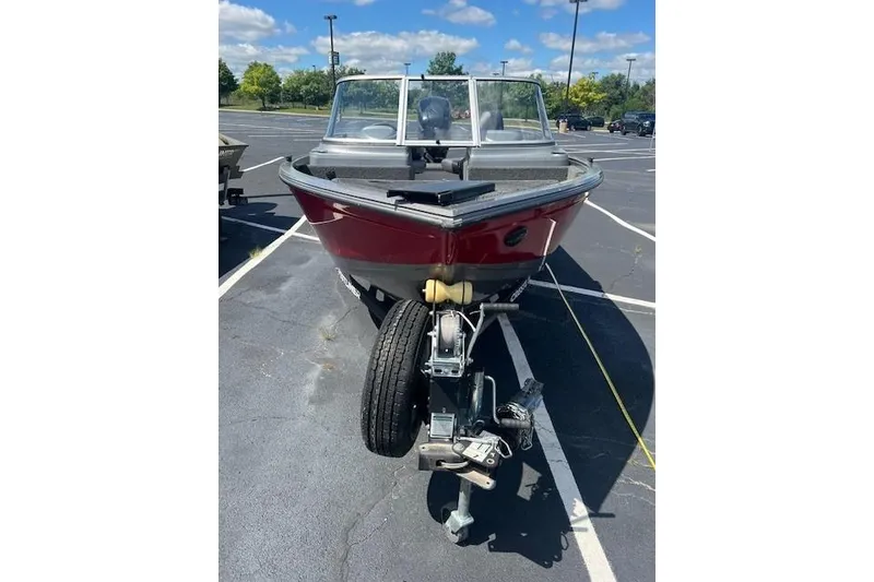 Slide: The Image of 2019 Crestliner 1700 Vision boat on trailer in parking lot, sunny day. - 5