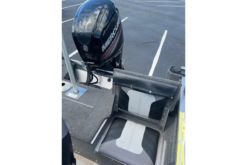 Slide: The Image of 2019 Crestliner 1700 Vision boat with Mercury outboard motor and cushioned seating. - 7