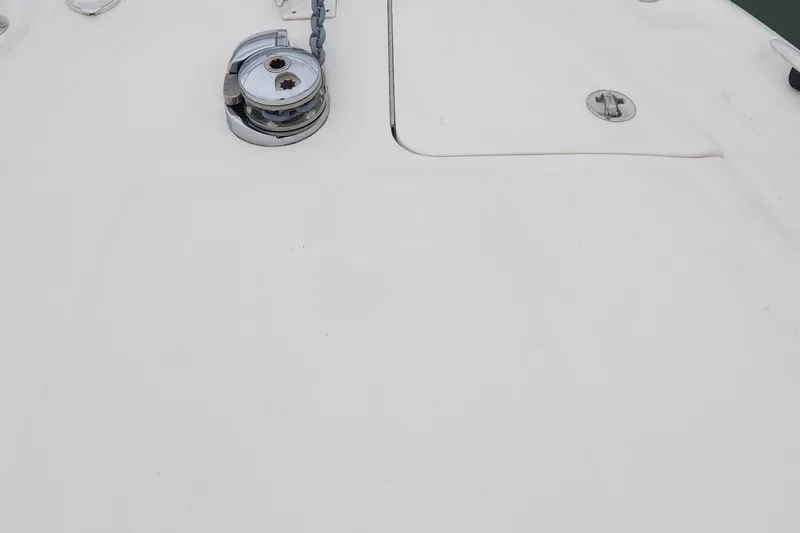 Slide: The Image of Deck of 2005 Sea Ray 320 Sundancer with anchor winch and hatch. - 14