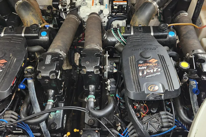 Slide: The Image of Engine compartment of a 2005 Sea Ray 320 Sundancer with MerCruiser 350 MPI Horizon engines. - 16