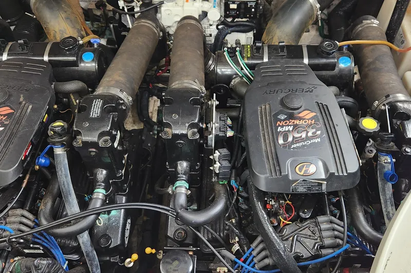 Slide: The Image of Engine compartment of a 2005 Sea Ray 320 Sundancer with MerCruiser 350 MPI Horizon engines. - 17