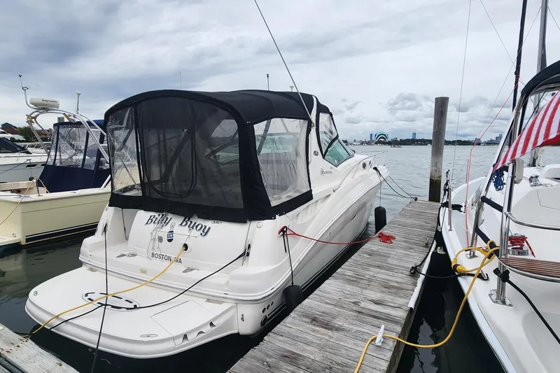 Slide: The Image of 2005 Sea Ray 320 Sundancer docked at marina, overcast sky, Boston, MA. - 2