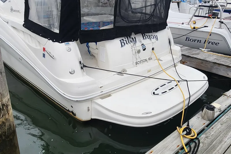Slide: The Image of 2005 Sea Ray 320 Sundancer docked, featuring "Billy Buoy" name, Boston, MA. - 4