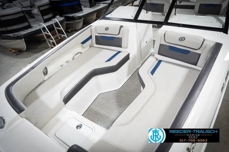 Slide: The Image of 2022 Hurricane 235RD boat interior with sleek seating and modern design. - 11