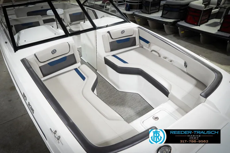 Slide: The Image of 2022 Hurricane 235RD boat interior with gray and blue seating, showcased at Reeder-Trausch Marine. - 12