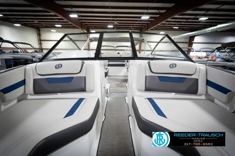 Slide: The Image of 2022 Hurricane 235RD boat interior with sleek seating in showroom. - 18