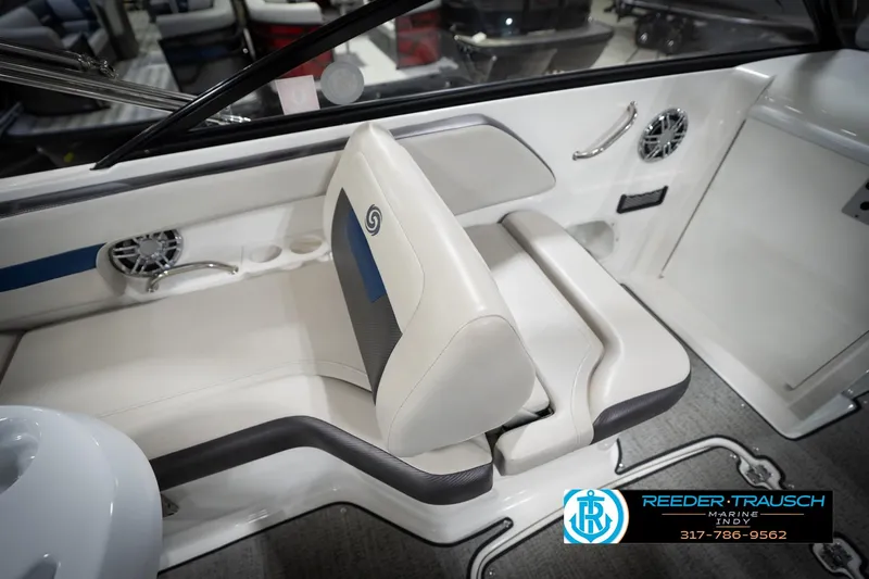 Slide: The Image of 2022 Hurricane 235RD boat interior with white seating and speaker system. - 23
