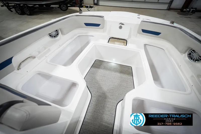 Slide: The Image of 2022 Hurricane 235RD boat interior with spacious seating and storage compartments. - 28