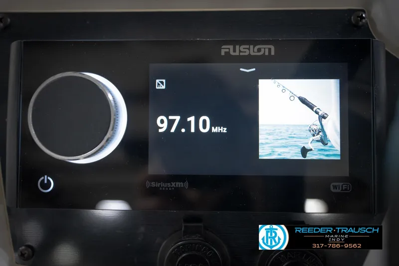 Slide: The Image of Fusion marine stereo display on 2022 Hurricane 235RD, showing 97.10 MHz frequency. - 32