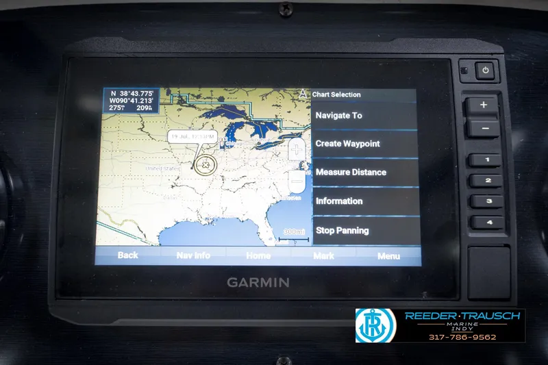 Slide: The Image of Garmin navigation system on 2022 Hurricane 235RD boat, displaying U.S. map and chart options. - 34