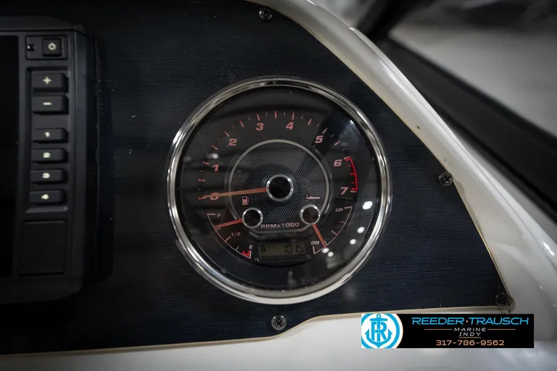 Slide: The Image of Dashboard of 2022 Hurricane 235RD boat with tachometer and control panel. - 35
