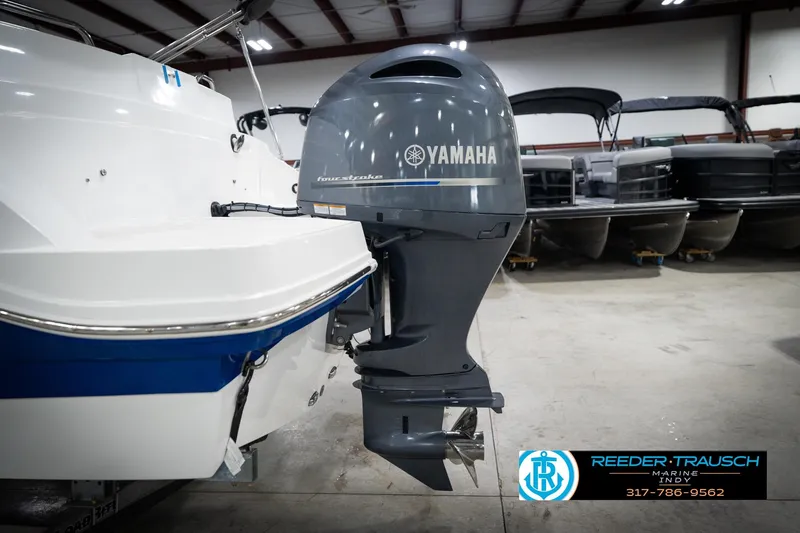 Slide: The Image of 2022 Hurricane 235RD boat with Yamaha four-stroke outboard motor in showroom. - 47
